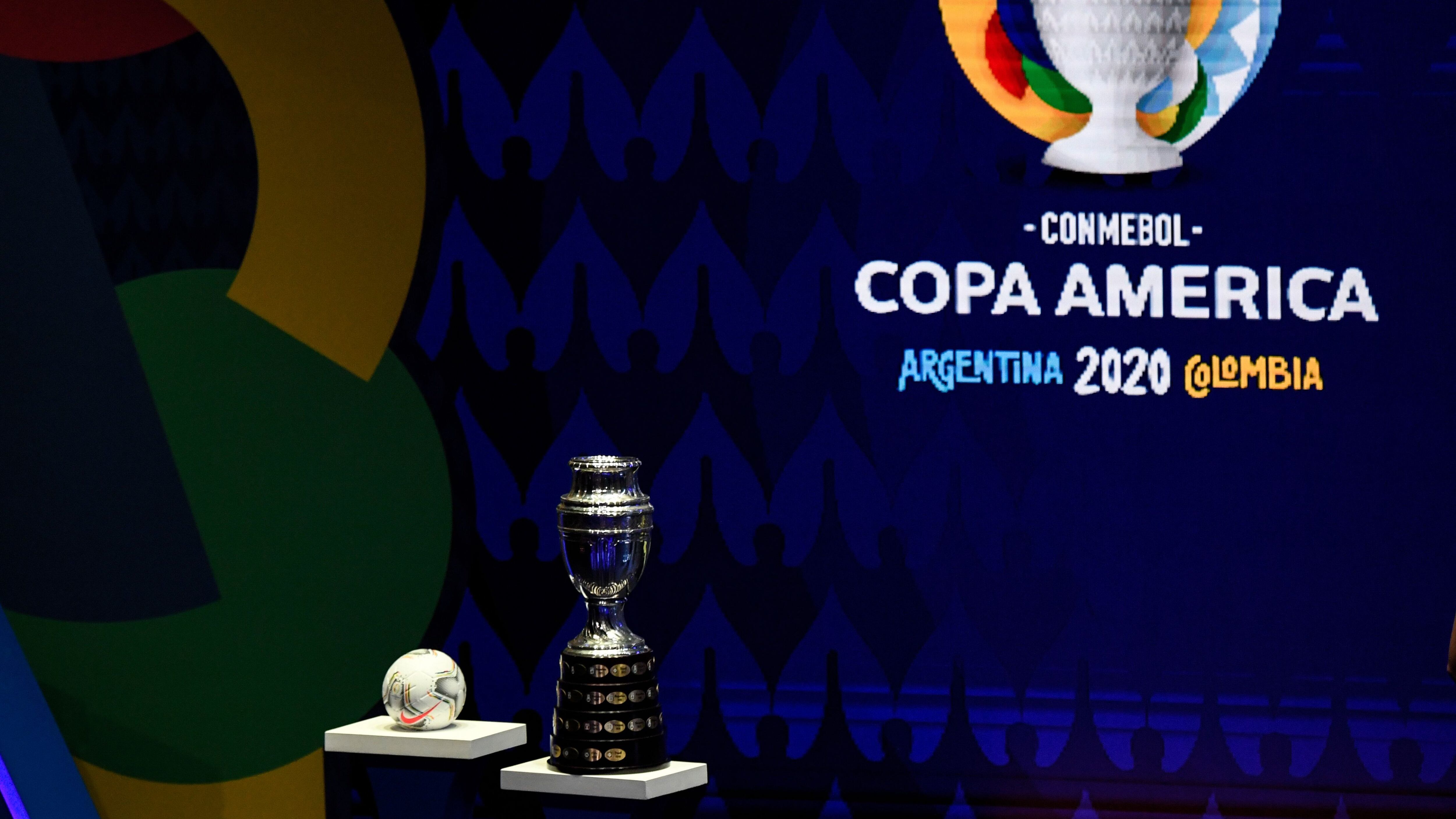 The Copa America trophy and the official ball are seen during the draw of the Copa America 2020 football tournament, at the Convention Centre in Cartagena, Colombia, on December 3, 2019. - The Copa America 2020 football tournament will be held jointly by Argentina and Colombia next year from June 12 to July 12. Asian champions Qatar and previous winner Australia will participate as invited guest teams. (Photo by Juan BARRETO / AFP) (Photo by JUAN BARRETO/AFP via Getty Images)