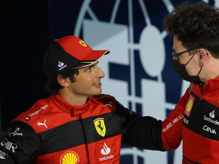 Second placed Ferrari's Spanish driver Carlos Sainz Jr (L) talks with Ferrari team principal Mattia Binotto after the Bahrain Formula One Grand Prix at the Bahrain International Circuit in the city of Sakhir on March 20, 2022. (Photo by Giuseppe CACACE / AFP) (Photo by GIUSEPPE CACACE/AFP via Getty Images)