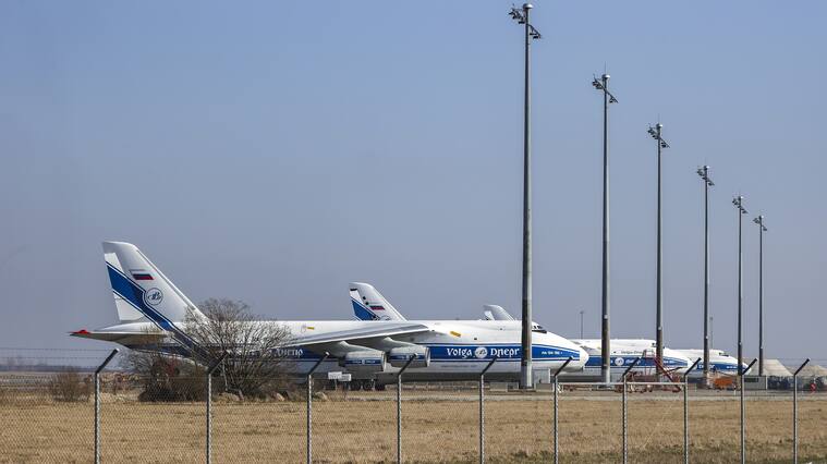 28 February 2022, Saxony, Schkeuditz: Three Antonov An-124 cargo aircraft of the Russian Volga-Dnepr Group are parked at Leipzig/Halle Airport. The aircraft are no longer allowed to take off because EU airspace is closed to Russian aircraft. Photo: Jan Woitas/dpa-Zentralbild/dpa (Photo by Jan Woitas/picture alliance via Getty Images)