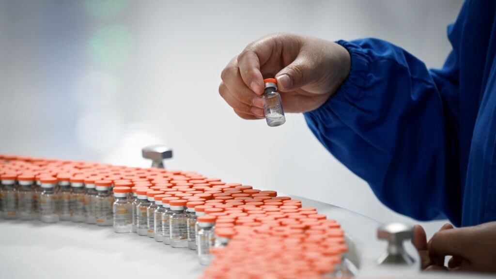 A staff member works during a media tour of a new factory built to produce a COVID-19 coronavirus vaccine at Sinovac, one of 11 Chinese companies approved to carry out clinical trials of potential coronavirus vaccines, in Beijing on September 24, 2020. (Photo by WANG ZHAO / AFP) (Photo by WANG ZHAO/AFP via Getty Images)