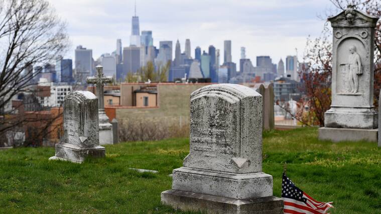 The skyline of lower Manhattan with One World Trade Center is seen from a cemetery on April 10, 2020 in New York City. (Photo by Angela Weiss / AFP) (Photo by ANGELA WEISS/AFP via Getty Images)