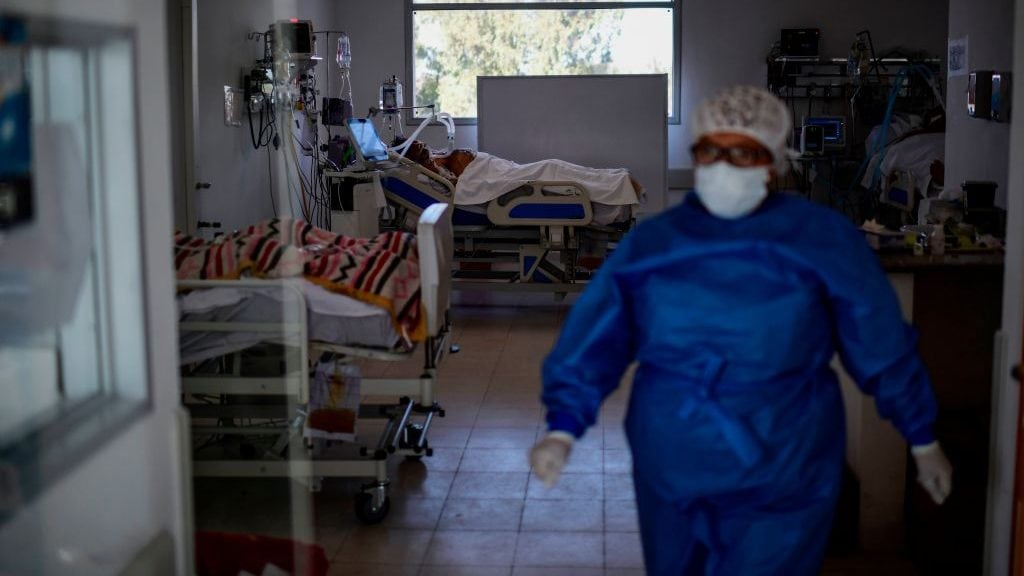 A patient lies in bed at the Professor Alejandro Posadas National Hospital in the municipality of El Palomar, province of Buenos Aires, on September 18, 2020, amid the COVID-19 novel coronavirus pandemic. - The pandemic has killed at least 946,727 people worldwide, including more than 12,000 in Argentina, since emerging in China late last year, according to an AFP tally at 1100 GMT Friday based on official sources. (Photo by Ronaldo SCHEMIDT / AFP) (Photo by RONALDO SCHEMIDT/AFP via Getty Images)