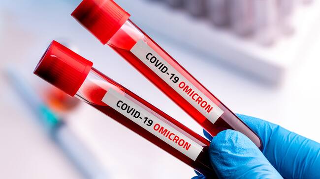Doctor with blood sample of Covid-19 Omicron B.1.1.529 Variant and general data of covid-19 Coronavirus Mutations.