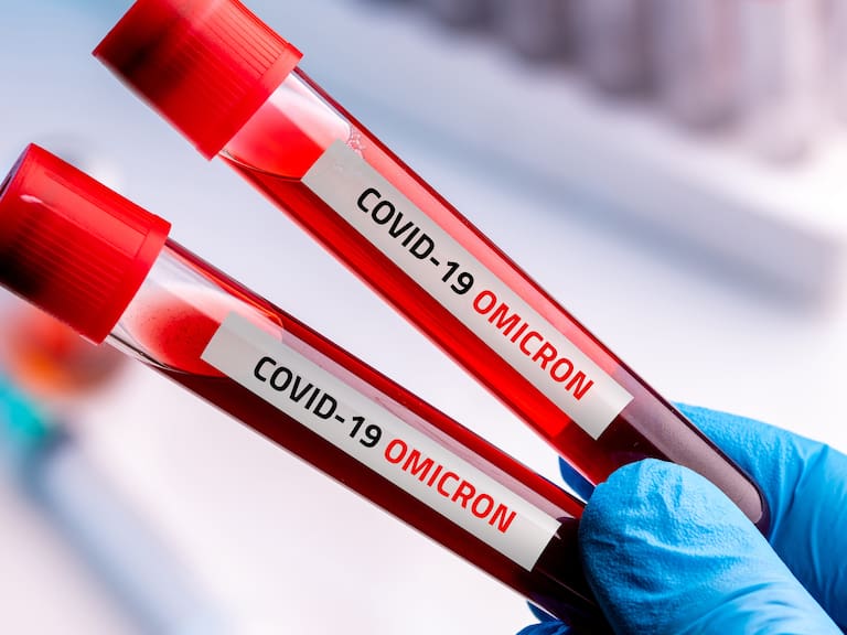 Doctor with blood sample of Covid-19 Omicron B.1.1.529 Variant and general data of covid-19 Coronavirus Mutations.