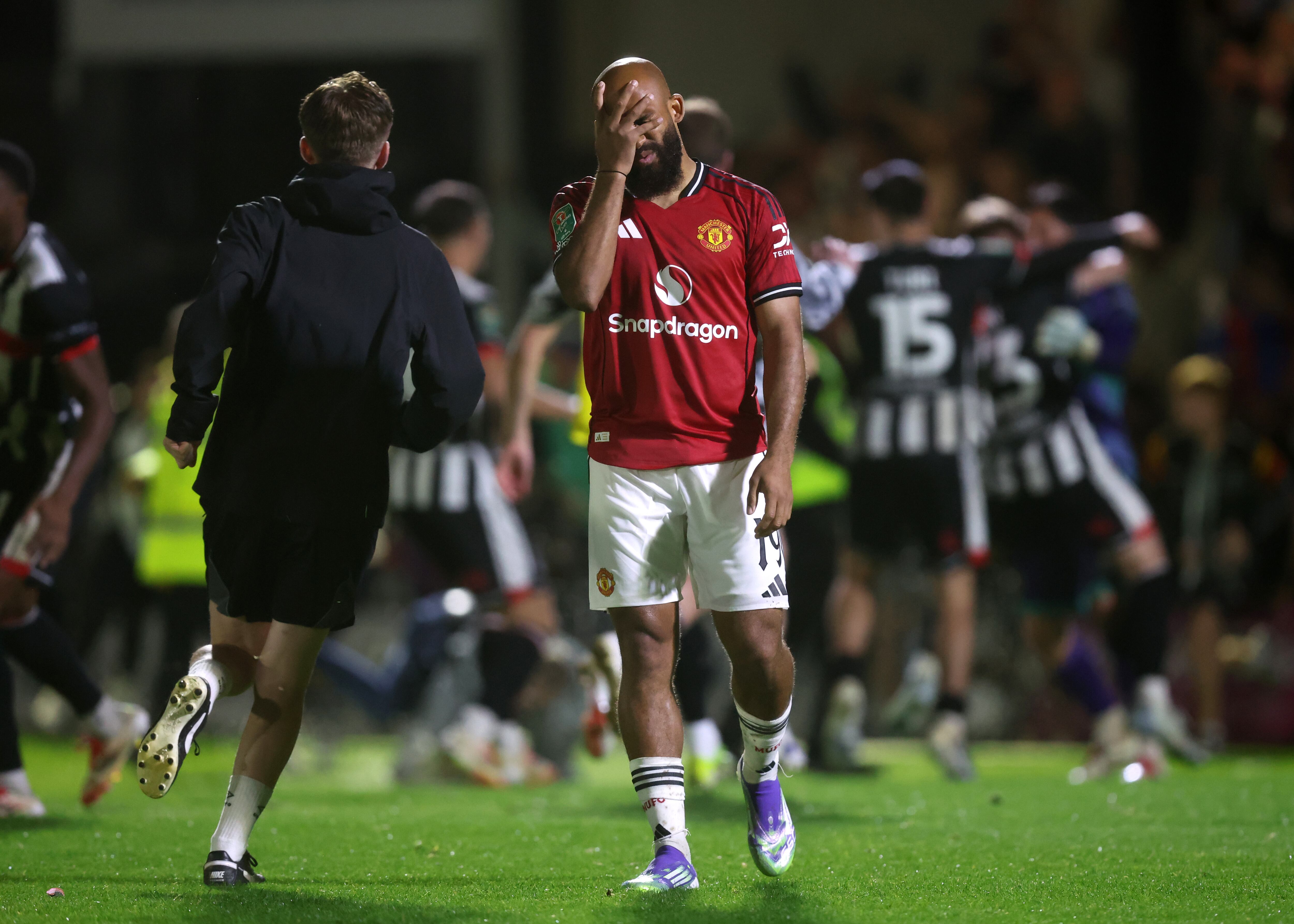 GRIMSBY, ENGLAND - AUGUST 27: Bryan Mbeumo of Manchester United looks dejected after missing his teams thirteenth penalty during the Carabao Cup Second Round match between Grimsby Town and Manchester United at Blundell Park on August 27, 2025 in Grimsby, England.  (Photo by George Wood/Getty Images)