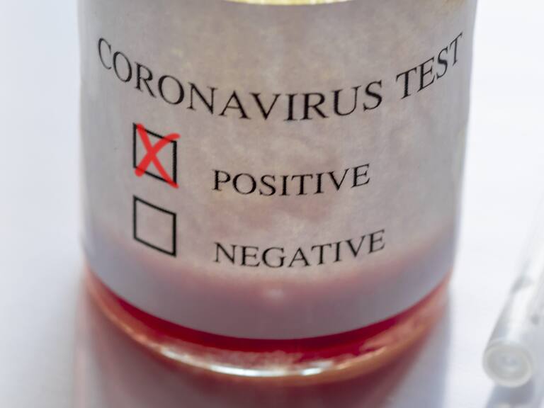 Syringe and ampoule containing coronavirus positive blood test