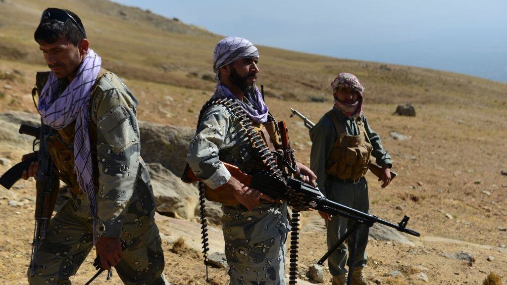 Afghan resistance movement and anti-Taliban uprising forces patrol on a hilltop in Darband area in Anaba district, Panjshir province on September 1, 2021. - Panjshir -- famous for its natural defences never penetrated by Soviet forces or the Taliban in earlier conflicts -- remains the last major holdout of anti-Taliban forces led by Ahmad Massoud, son of the famed Mujahideen leader Ahmed Shah Massoud. (Photo by Ahmad SAHEL ARMAN / AFP) (Photo by AHMAD SAHEL ARMAN/AFP via Getty Images)