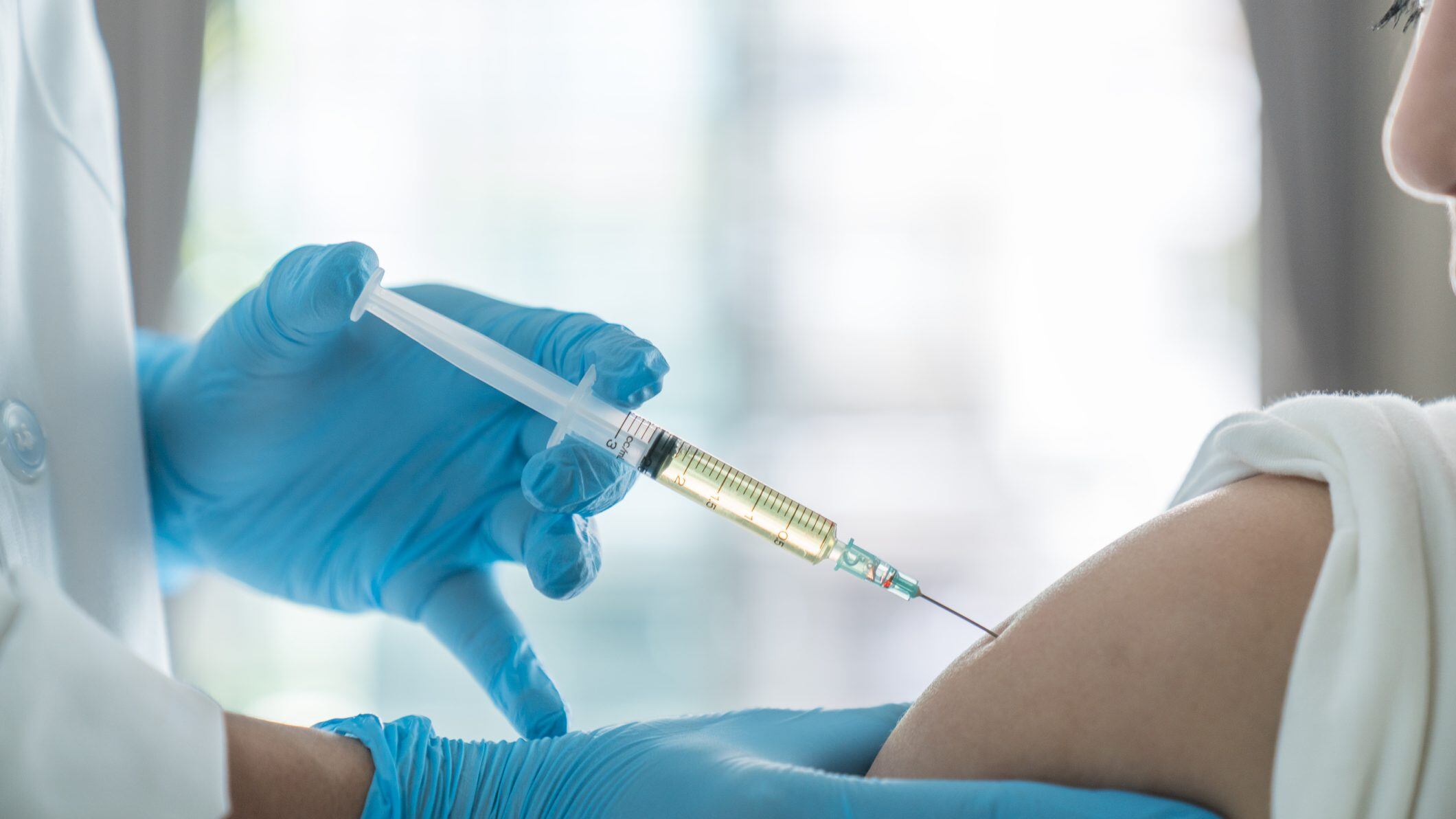 doctor make vaccinating to patient