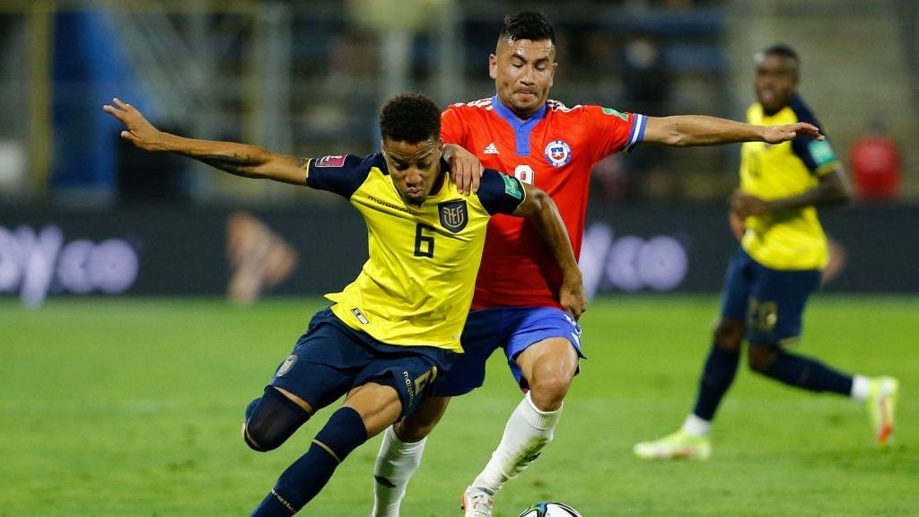 Ecuador's Byron Castillo (L) and Chile's Jean Meneses vie for the ball during their South American qualification football match for the FIFA World Cup Qatar 2022 at the San Carlos de Apoquindo stadium in Santiago, on November 16, 2021. (Photo by Marcelo HERNANDEZ / POOL / AFP) (Photo by MARCELO HERNANDEZ/POOL/AFP via Getty Images)
