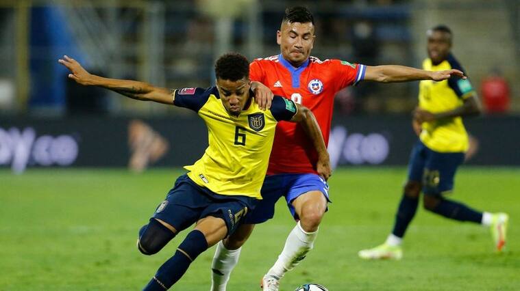 Ecuador's Byron Castillo (L) and Chile's Jean Meneses vie for the ball during their South American qualification football match for the FIFA World Cup Qatar 2022 at the San Carlos de Apoquindo stadium in Santiago, on November 16, 2021. (Photo by Marcelo HERNANDEZ / POOL / AFP) (Photo by MARCELO HERNANDEZ/POOL/AFP via Getty Images)
