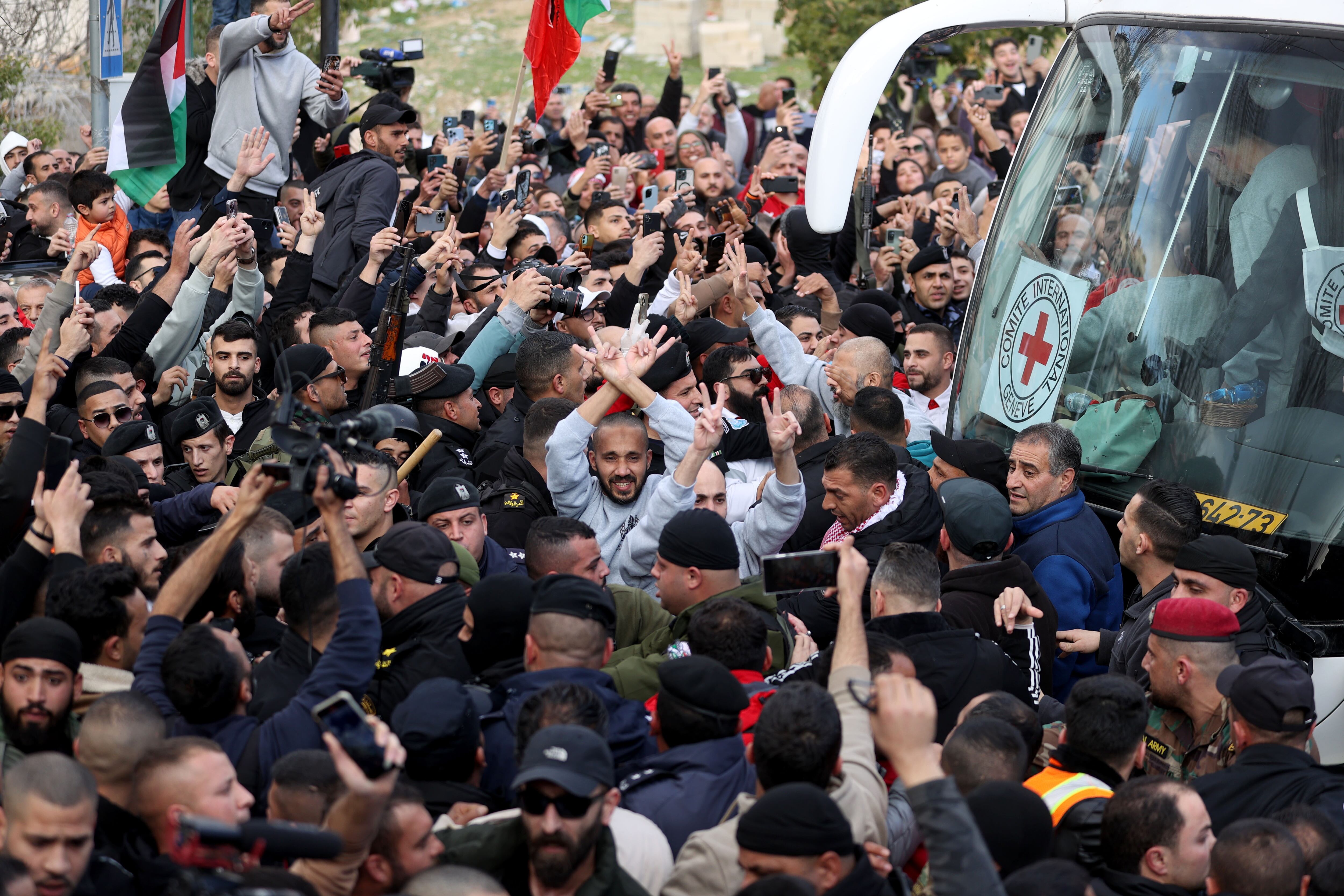RAMALLAH, WEST BANK - JANUARY 25: Palestinian prisoners, released as part of the second phase of the prisoner and hostage swap agreement between Hamas and Israel, are welcomed by their relatives after a Red Cross convoy, carrying Palestinian prisoners, arrive in Ramallah, West Bank on January 25, 2025. (Photo by Issam Rimawi/Anadolu via Getty Images)