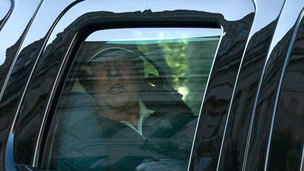 US President Donald Trump watches from the motorcade as he returns to the White House in Washington, DC, after playing golf on November 7, 2020. - Joyous celebrations erupted in Washington on Saturday after Joe Biden was declared winner of the US presidency, as several people poured into the streets of the US capital -- some of them chanting, cheering and singing in front of the White House. (Photo by ALEX EDELMAN / AFP) (Photo by ALEX EDELMAN/AFP via Getty Images)