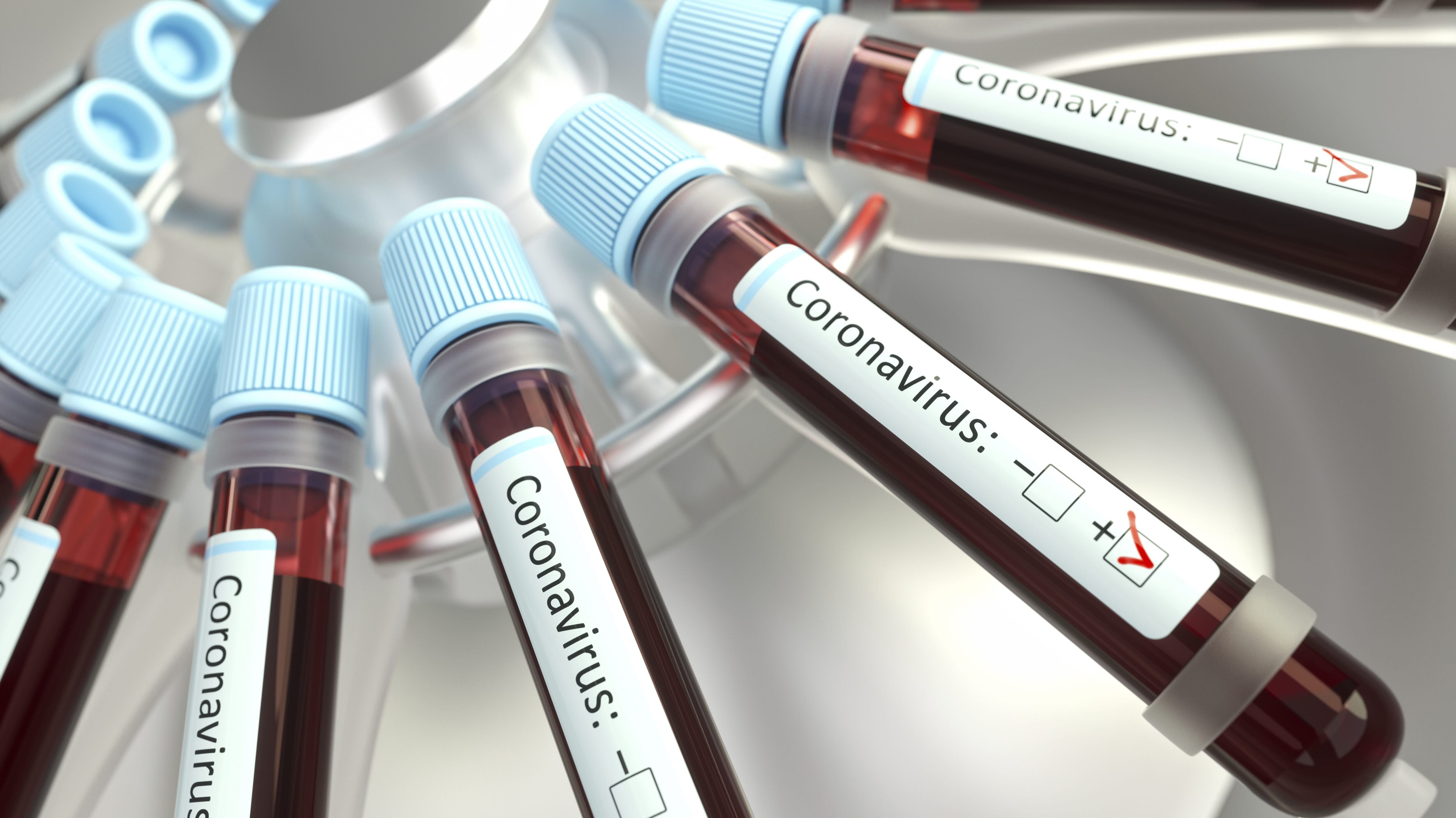 Coronaviruses research, conceptual illustration. Vials of blood in a centrifuge being tested for coronavirus infection.