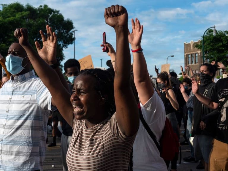 MINNEAPOLIS, MN - MAY 27: Protesters confront police outside the 3rd Police Precinct on May 27, 2020 in Minneapolis, Minnesota. Four Minneapolis police officers have been fired after a video taken by a bystander was posted on social media showing 46-year-old George Floyd&#039;s neck being pinned to the ground by an officer as he repeatedly said, &quot;I can’t breathe&quot;. Floyd was later pronounced dead while in police custody after being transported to Hennepin County Medical Center.  (Photo by Stephen Maturen/Getty Images)