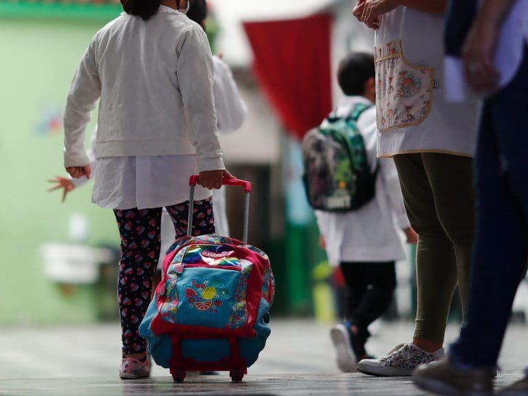BUENOS AIRES, ARGENTINA - FEBRUARY 17: Schoolchildren enter the Provincia de Cordoba school on February 17, 2021 in Buenos Aires, Argentina. Students of the first years of elementary and secondary school, representing 47% of the total, resume on site lessons after one year of home schooling due to coronavirus pandemic. The rest of the students will return on the following weeks. Government announced strict protocols to prevent spread of the virus. (Photo by Marcos Brindicci/Getty Images)