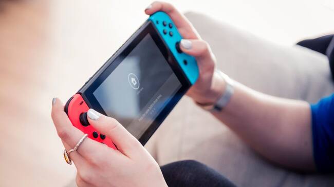 Detail of a young woman playing video games on a Nintendo Switch home console, taken on March 7, 2017. (Photo by James Sheppard/Future via Getty Images)