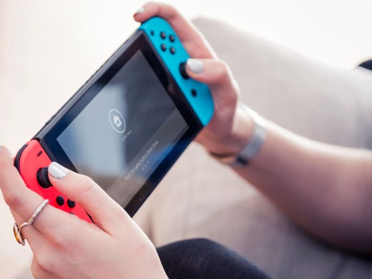 Detail of a young woman playing video games on a Nintendo Switch home console, taken on March 7, 2017. (Photo by James Sheppard/Future via Getty Images)