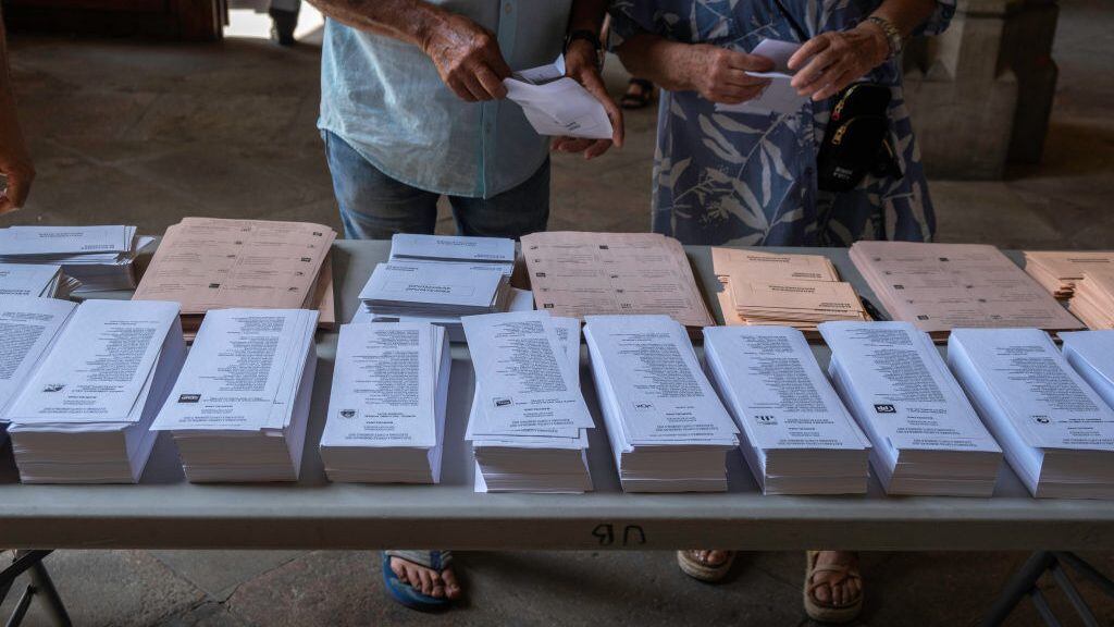BARCELONA, SPAIN - 2023/07/23: Ballot papers are seen on a table. At 9:00 a.m. the polling stations opened to hold the general elections in Spain to elect the 350 deputies and 208 senators. (Photo by Paco Freire/SOPA Images/LightRocket via Getty Images)