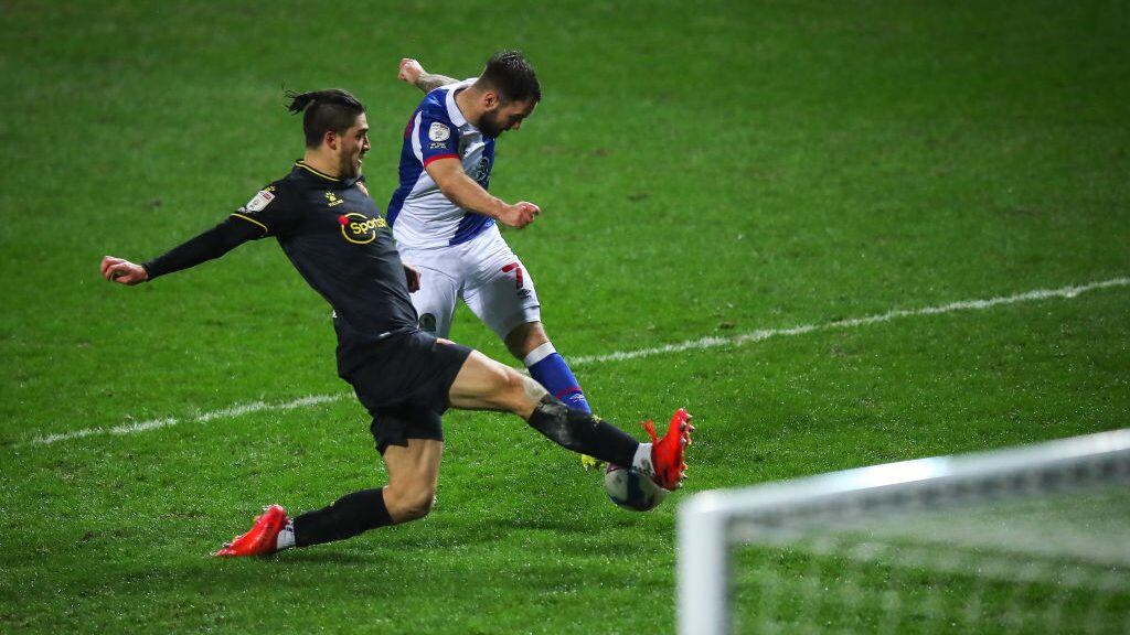 BLACKBURN, ENGLAND - FEBRUARY 24: Adam Armstrong of Blackburn Rovers has a shot blocked by Francisco Sierralta of Watford during the Sky Bet Championship match between Blackburn Rovers and Watford at Ewood Park on February 24, 2021 in Blackburn, England. Sporting stadiums around the UK remain under strict restrictions due to the Coronavirus Pandemic as Government social distancing laws prohibit fans inside venues resulting in games being played behind closed doors. (Photo by Robbie Jay Barratt - AMA/Getty Images)