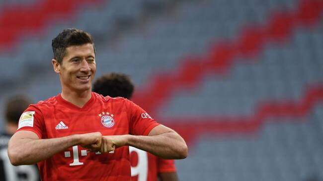 Bayern Munich's Polish forward Robert Lewandowski reacts after scoring his 4-0 during the German first division Bundesliga football match FC Bayern Munich v Fortuna Duesseldorf on May 30, 2020 in Munich, southern Germany. (Photo by Christof STACHE / various sources / AFP) / DFL REGULATIONS PROHIBIT ANY USE OF PHOTOGRAPHS AS IMAGE SEQUENCES AND/OR QUASI-VIDEO (Photo by CHRISTOF STACHE/AFP via Getty Images)