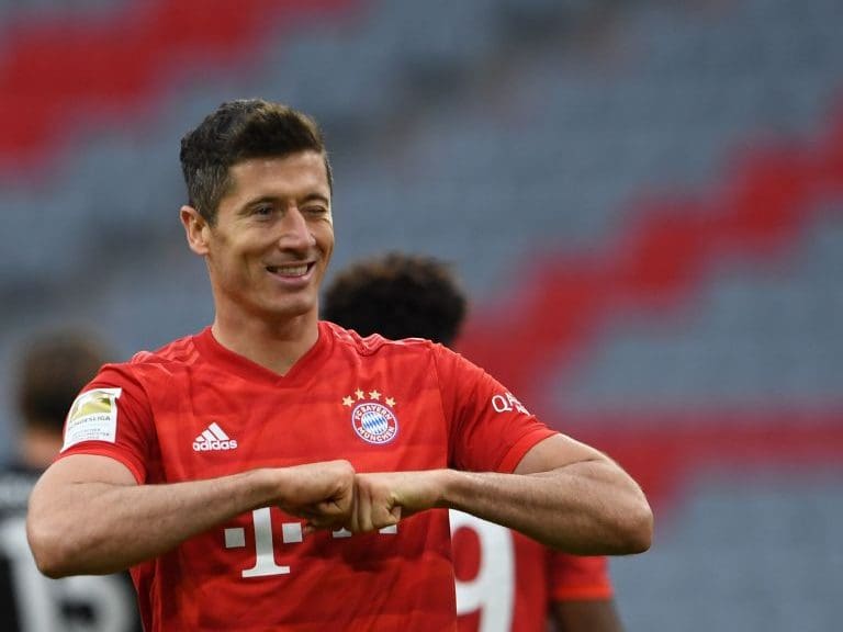 Bayern Munich&#039;s Polish forward Robert Lewandowski reacts after scoring his 4-0 during the German first division Bundesliga football match FC Bayern Munich v Fortuna Duesseldorf on May 30, 2020 in Munich, southern Germany. (Photo by Christof STACHE / various sources / AFP) / DFL REGULATIONS PROHIBIT ANY USE OF PHOTOGRAPHS AS IMAGE SEQUENCES AND/OR QUASI-VIDEO (Photo by CHRISTOF STACHE/AFP via Getty Images)
