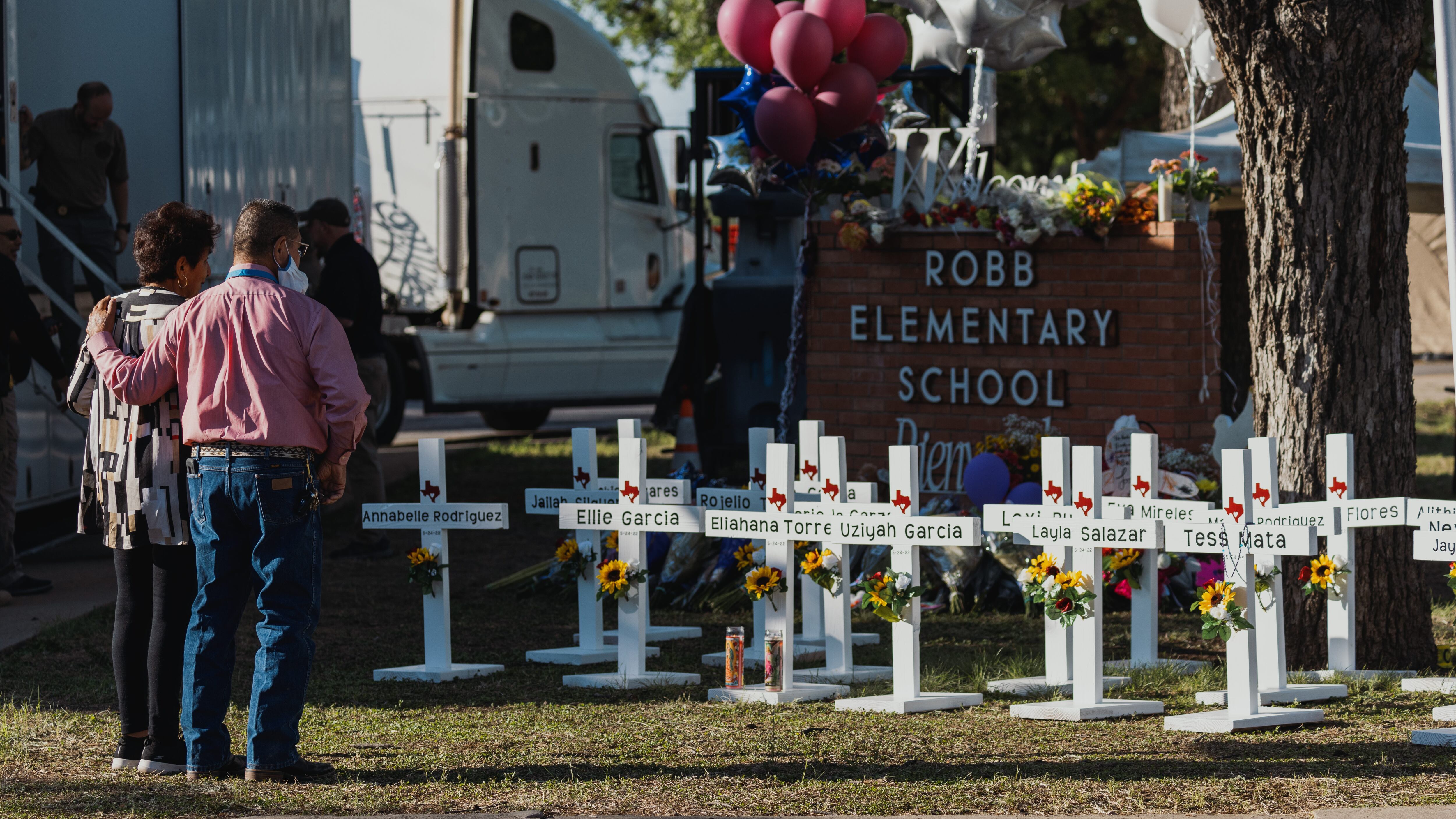 UVALDE, TX - MAY 26: Crosses bearing the names of the victims of a mass shooting in front of Robb Elementary School on May 26, 2022 in Uvalde, Texas. The rural Texas community is in mourning following a shooting at Robb Elementary School which killed 21 people including 19 children. (Photo by Jordan Vonderhaar/Getty Images)