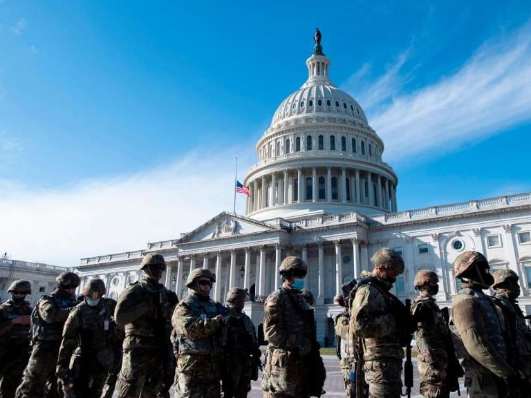 Members of the US National Guard arrive as the US Capitol goes into lockdown  after an &quot;external security threat&quot; prior to a dress rehearsal for the 59th inaugural ceremony for President-elect Joe Biden and Vice President-elect Kamala Harris at the US Capitol on January 18, 2021 in Washington, DC. - The Inauguration is scheduled for January 20, 2021. (Photo by Rod LAMKEY / POOL / AFP) (Photo by ROD LAMKEY/POOL/AFP via Getty Images)