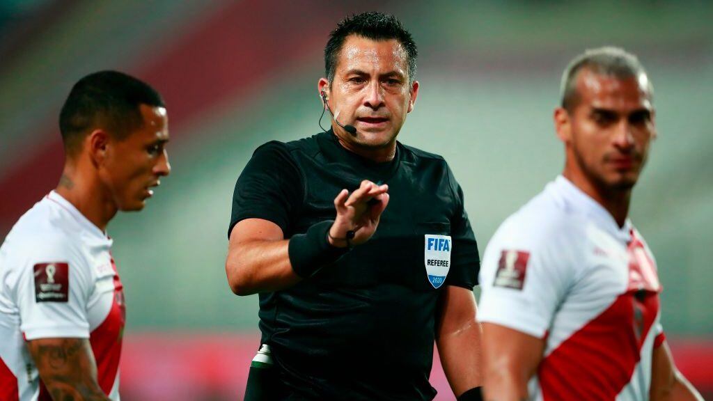 Chilean referee Julio Bascunan conducts the 2022 FIFA World Cup South American qualifier football match between Peru and Brazil at the National Stadium in Lima, on October 13, 2020, amid the COVID-19 novel coronavirus pandemic. (Photo by Daniel APUY / POOL / AFP) (Photo by DANIEL APUY/POOL/AFP via Getty Images)