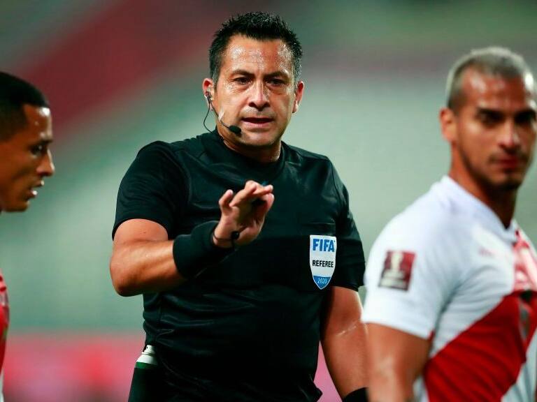 Chilean referee Julio Bascunan conducts the 2022 FIFA World Cup South American qualifier football match between Peru and Brazil at the National Stadium in Lima, on October 13, 2020, amid the COVID-19 novel coronavirus pandemic. (Photo by Daniel APUY / POOL / AFP) (Photo by DANIEL APUY/POOL/AFP via Getty Images)