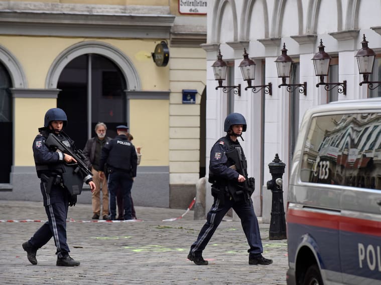 VIENNA, AUSTRIA - NOVEMBER 03: Policemen walk past markings on the ground showing one of the crime scenes in the city center the day after a deadly shooting spree on November 03, 2020 in Vienna, Germany. One gunman, identified as a Chechen man who had sworn alliance to the Islamic State (IS), was shot and killed by police after he ran shooting with a long gun through an area with restaurants and cafes. So far four people are confirmed dead and 17 wounded. Police are searching for a second possible suspect. (Photo by Thomas Kronsteiner/Getty Images)