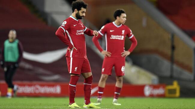 Liverpool's Mohamed Salah and Trent Alexander-Arnold appear dejected during the Premier League match at Anfield, Liverpool. Picture date: Thursday January 21, 2021. (Photo by Peter Powell/PA Images via Getty Images)