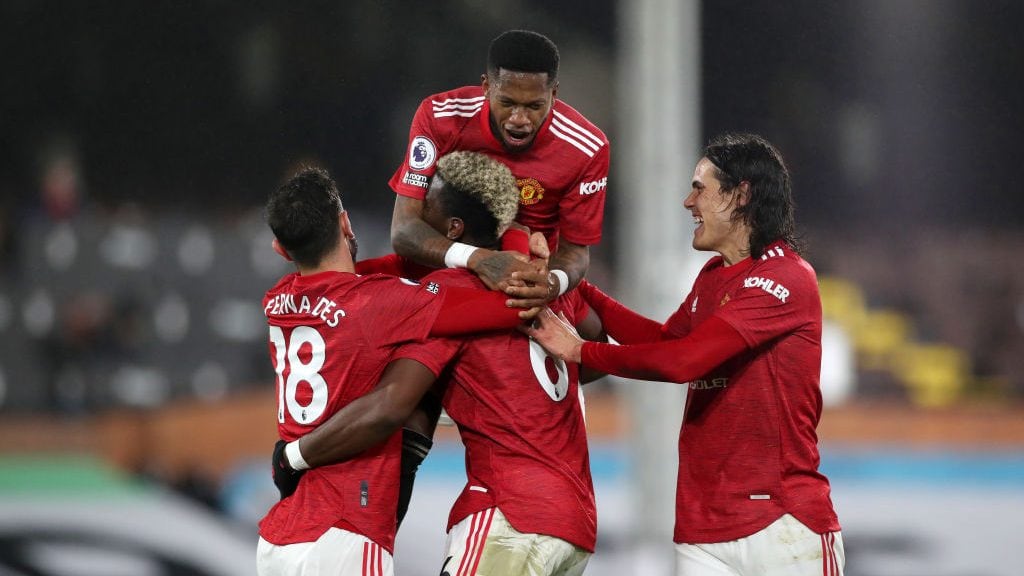 LONDON, ENGLAND - JANUARY 20: Paul Pogba of Manchester United celebrates with team mates (L-R) Bruno Fernandes, Fred and Edinson Cavani after scoring their side's second goal during the Premier League match between Fulham and Manchester United at Craven Cottage on January 20, 2021 in London, England. Sporting stadiums around the UK remain under strict restrictions due to the Coronavirus Pandemic as Government social distancing laws prohibit fans inside venues resulting in games being played behind closed doors. (Photo by Peter Cziborra - Pool/Getty Images)
