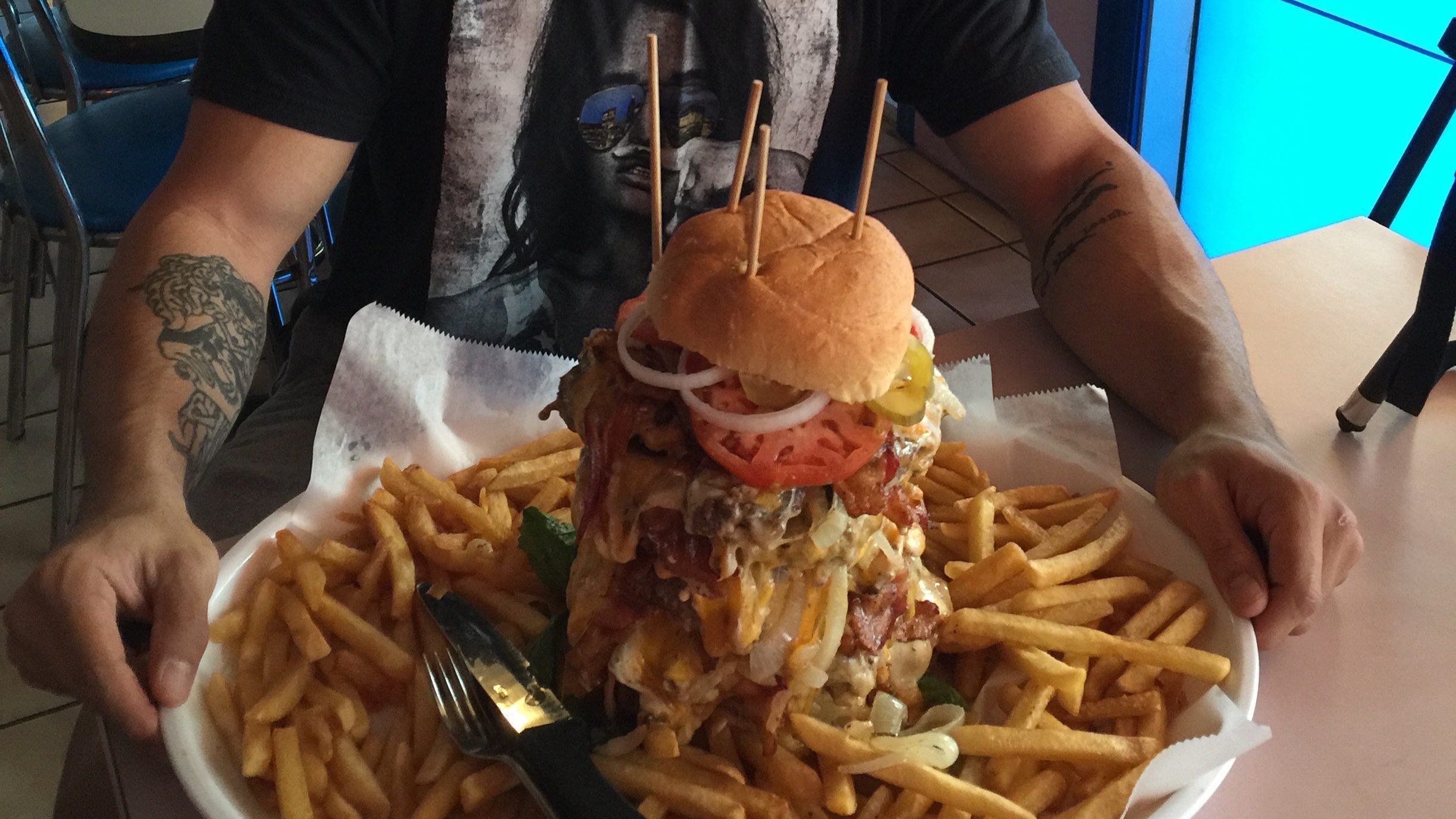 *** EXCLUSIVE - VIDEO AVAILABLE ***
UNKNOWN - UNDATED: Nathan Figueroa with six 1lb patties with bacon, vegetables, cheese and 2lbs of fries.
A fitness fanatic and slender Youtuber proves that he is a food challenge machine - by devouring gigantic 15,000 calorie meals in minutes.Nathan Figeuroa, 29, has proven to the world that his eyes definitely arent bigger than his stomach, by consuming large meals from an 80oz steak, a 28 inch pizza, a 6 lbs burrito and a whopping 10 lbs burger and fries challenge. The videographer from Florida started his food challenges in 2015 after he saw a picture of his friend eating a giant burger on social media. Nathan contacted his friend and asked if he could join him in the food challenge and has been gulping down ginormous portions of food for his 230,000 followers ever since.
PHOTOGRAPH BY Nathan Figueroa / Barcroft Images
London-T:+44 207 033 1031 E:hello@barcroftmedia.com -
New York-T:+1 212 796 2458 E:hello@barcroftusa.com -
New Delhi-T:+91 11 4053 2429 E:hello@barcroftindia.com www.barcroftmedia.com (Photo credit should read Nathan Figueroa / Barcroft Image / Barcroft Media via Getty Images)