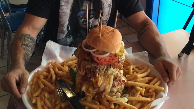 *** EXCLUSIVE - VIDEO AVAILABLE ***
UNKNOWN - UNDATED: Nathan Figueroa with six 1lb patties with bacon, vegetables, cheese and 2lbs of fries.
A fitness fanatic and slender Youtuber proves that he is a food challenge machine - by devouring gigantic 15,000 calorie meals in minutes.Nathan Figeuroa, 29, has proven to the world that his eyes definitely arent bigger than his stomach, by consuming large meals from an 80oz steak, a 28 inch pizza, a 6 lbs burrito and a whopping 10 lbs burger and fries challenge. The videographer from Florida started his food challenges in 2015 after he saw a picture of his friend eating a giant burger on social media. Nathan contacted his friend and asked if he could join him in the food challenge and has been gulping down ginormous portions of food for his 230,000 followers ever since.
PHOTOGRAPH BY Nathan Figueroa / Barcroft Images
London-T:+44 207 033 1031 E:hello@barcroftmedia.com -
New York-T:+1 212 796 2458 E:hello@barcroftusa.com -
New Delhi-T:+91 11 4053 2429 E:hello@barcroftindia.com www.barcroftmedia.com (Photo credit should read Nathan Figueroa / Barcroft Image / Barcroft Media via Getty Images)