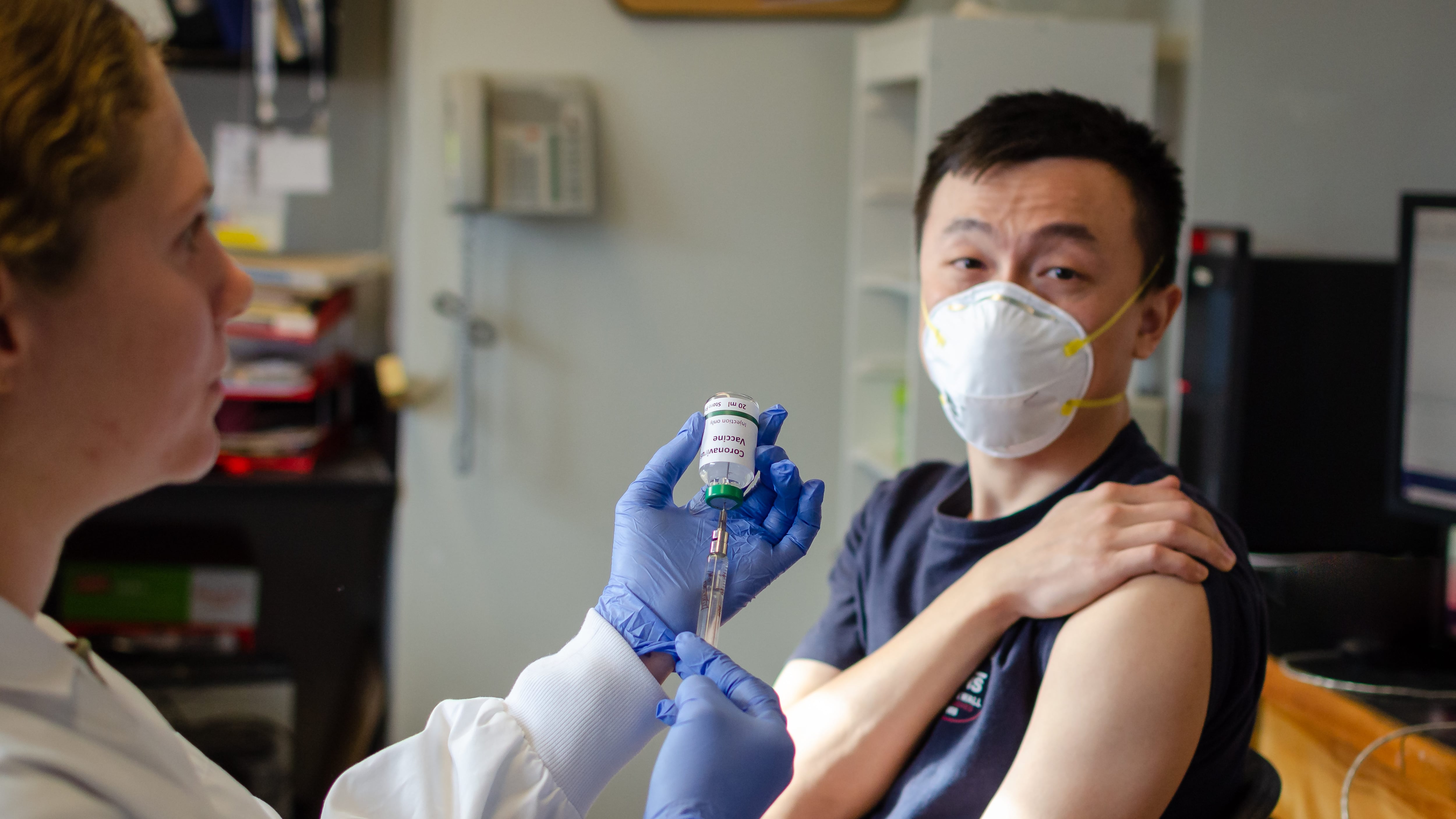 Illustrative picture of Chinese male getting vaccinated against coronavirus