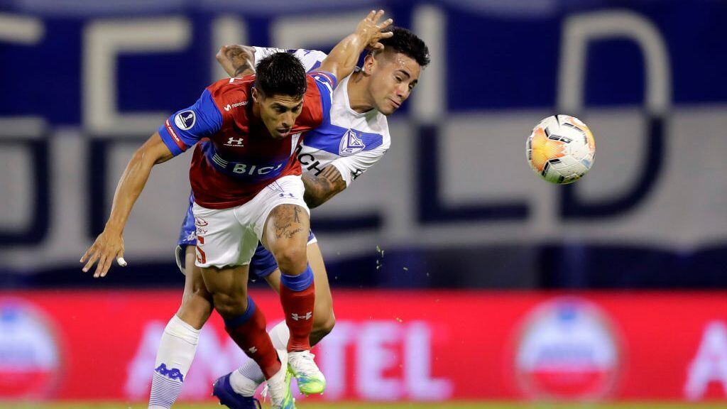 BUENOS AIRES, ARGENTINA - DECEMBER 08: Francisco Ortega of Velez and Valber Huerta of U Católica compete for the ball during a first leg match between Velez and Universidad Catolica as part of Copa CONMEBOL Sudamericana 2020 quarter finals at Jose Amalfitani Stadium on December 08, 2020 in Buenos Aires, Argentina. (Photo by Juan I. Roncoroni-Pool/Getty Images)