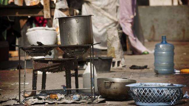 "Preparing food for the family. IDP Camp in center of Port au PrinceSee other photos of Haiti, february 2010:"