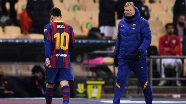 SEVILLE, SPAIN - JANUARY 17: Ronald Koeman, Manager of Barcelona reacts as Lionel Messi of Barcelona walks off the field after being shown a red card during the Supercopa de Espana Final match between FC Barcelona and Athletic Club at Estadio de La Cartuja on January 17, 2021 in Seville, Spain. Sporting stadiums around Spain remain under strict restrictions due to the Coronavirus Pandemic as Government social distancing laws prohibit fans inside venues resulting in games being played behind closed doors. (Photo by David Ramos/Getty Images)