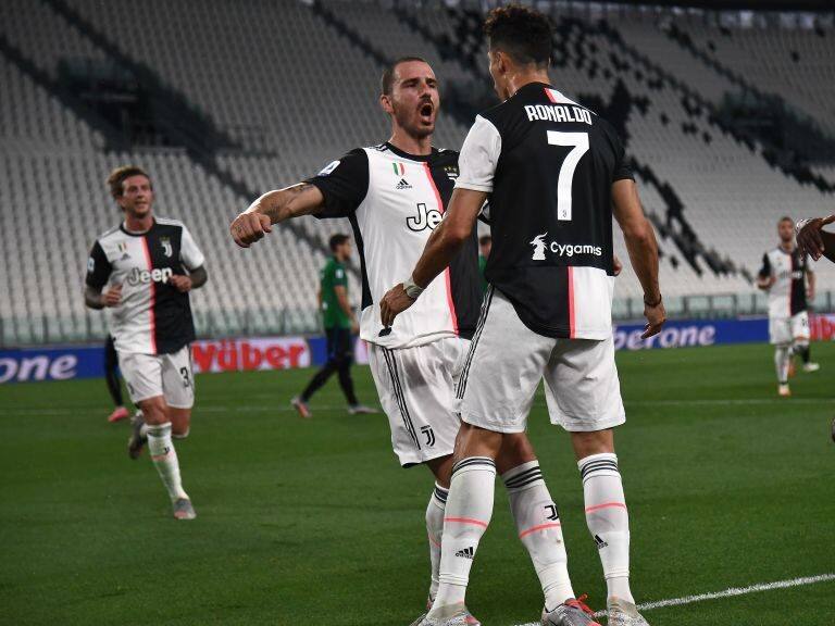 Juventus' Portuguese forward Cristiano Ronaldo (C) celebrates with Juventus' Italian defender Leonardo Bonucci (L) and Juventus' French midfielder Blaise Matuidi (R) after scoring a penalty during the Italian Serie A football match Juventus Turin vs Atalanta Bergamo played behind closed doors on July 11, 2020 at the Juventus stadium in Turin, as the country eases its lockdown aimed at curbing the spread of the COVID-19 infection, caused by the novel coronavirus. (Photo by Marco Bertorello / AFP) (Photo by MARCO BERTORELLO/AFP via Getty Images)