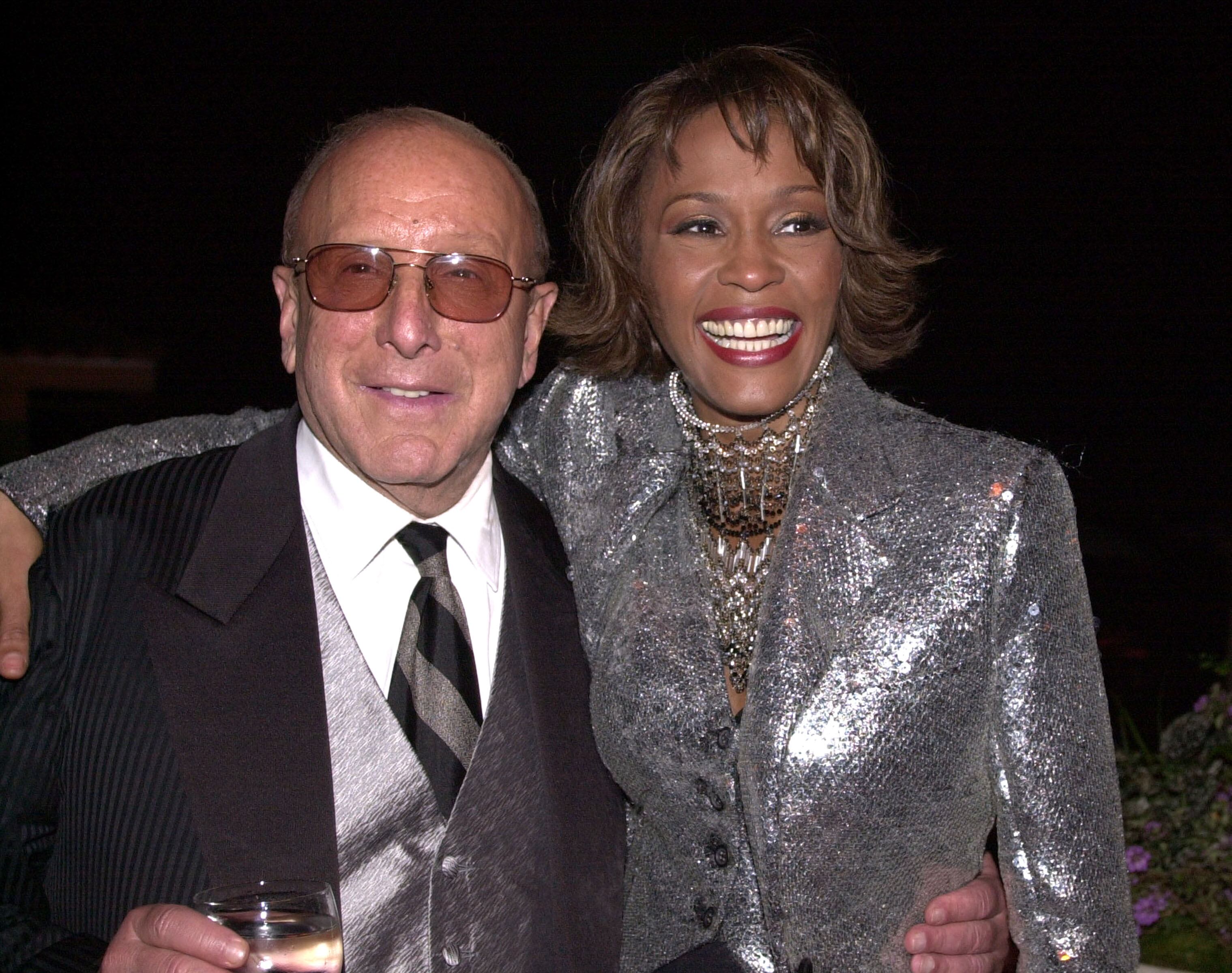 Clive Davis & Whitney Houston at the Private House in Los Angeles, California (Photo by Lester Cohen/WireImage)