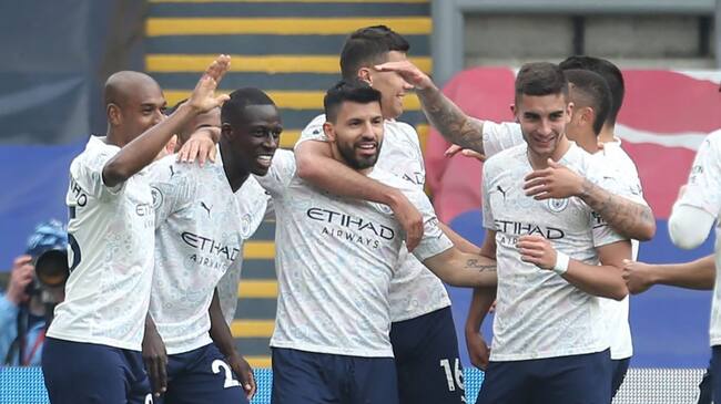 Manchester City's Argentinian striker Sergio Aguero (C) celebrates scoring his team's first goal with teammates during the English Premier League football match between Crystal Palace and Manchester City at Selhurst Park in south London on May 1, 2021. - RESTRICTED TO EDITORIAL USE. No use with unauthorized audio, video, data, fixture lists, club/league logos or 'live' services. Online in-match use limited to 120 images. An additional 40 images may be used in extra time. No video emulation. Social media in-match use limited to 120 images. An additional 40 images may be used in extra time. No use in betting publications, games or single club/league/player publications. (Photo by Steven Paston / POOL / AFP) / RESTRICTED TO EDITORIAL USE. No use with unauthorized audio, video, data, fixture lists, club/league logos or 'live' services. Online in-match use limited to 120 images. An additional 40 images may be used in extra time. No video emulation. Social media in-match use limited to 120 images. An additional 40 images may be used in extra time. No use in betting publications, games or single club/league/player publications. / RESTRICTED TO EDITORIAL USE. No use with unauthorized audio, video, data, fixture lists, club/league logos or 'live' services. Online in-match use limited to 120 images. An additional 40 images may be used in extra time. No video emulation. Social media in-match use limited to 120 images. An additional 40 images may be used in extra time. No use in betting publications, games or single club/league/player publications. (Photo by STEVEN PASTON/POOL/AFP via Getty Images)