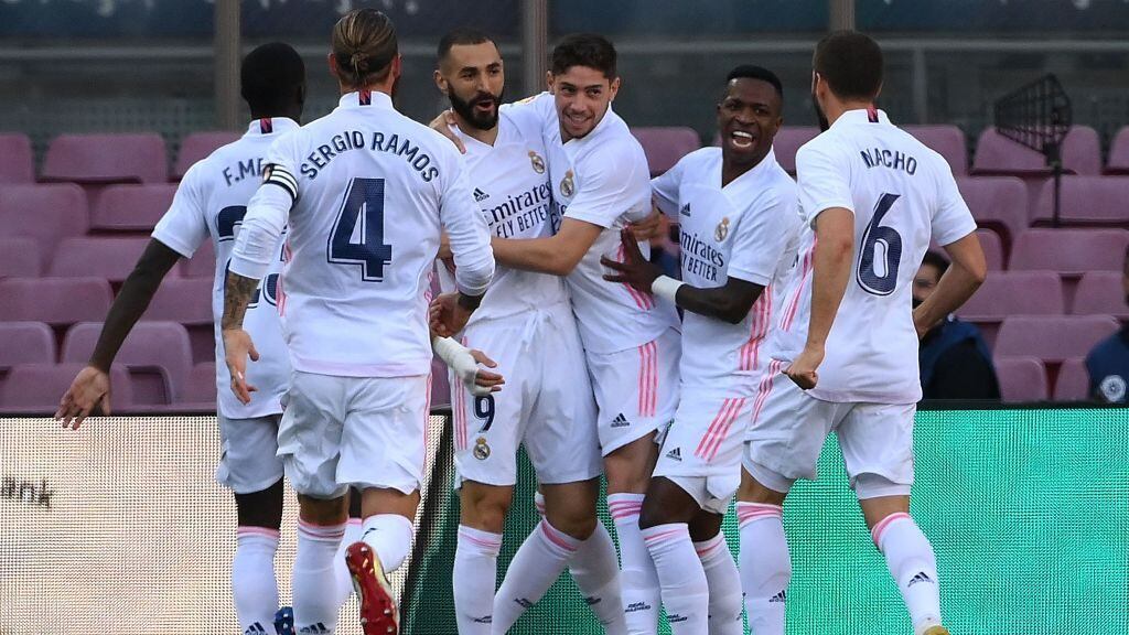 Real Madrid's players celebrate after scoring a goal during the Spanish League football match between Barcelona and Real Madrid at the Camp Nou stadium in Barcelona on October 24, 2020. (Photo by LLUIS GENE / AFP) (Photo by LLUIS GENE/AFP via Getty Images)