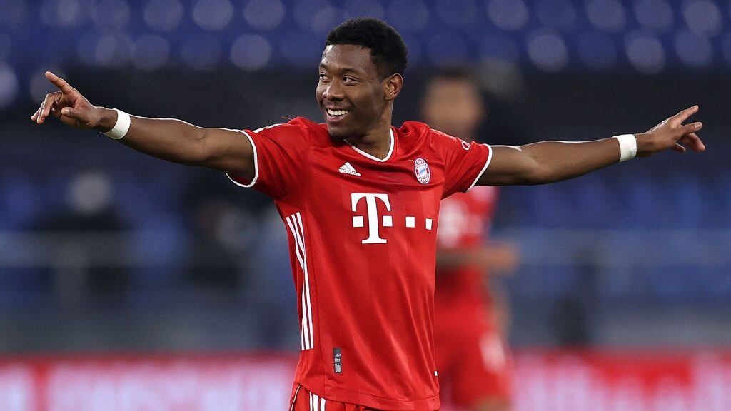GELSENKIRCHEN, GERMANY - JANUARY 24: David Alaba of Bayern Munich celebrates after scoring their sides fourth goal during the Bundesliga match between FC Schalke 04 and FC Bayern Muenchen at Veltins-Arena on January 24, 2021 in Gelsenkirchen, Germany. Sporting stadiums around Germany remain under strict restrictions due to the Coronavirus Pandemic as Government social distancing laws prohibit fans inside venues resulting in games being played behind closed doors. (Photo by Lars Baron/Getty Images)
