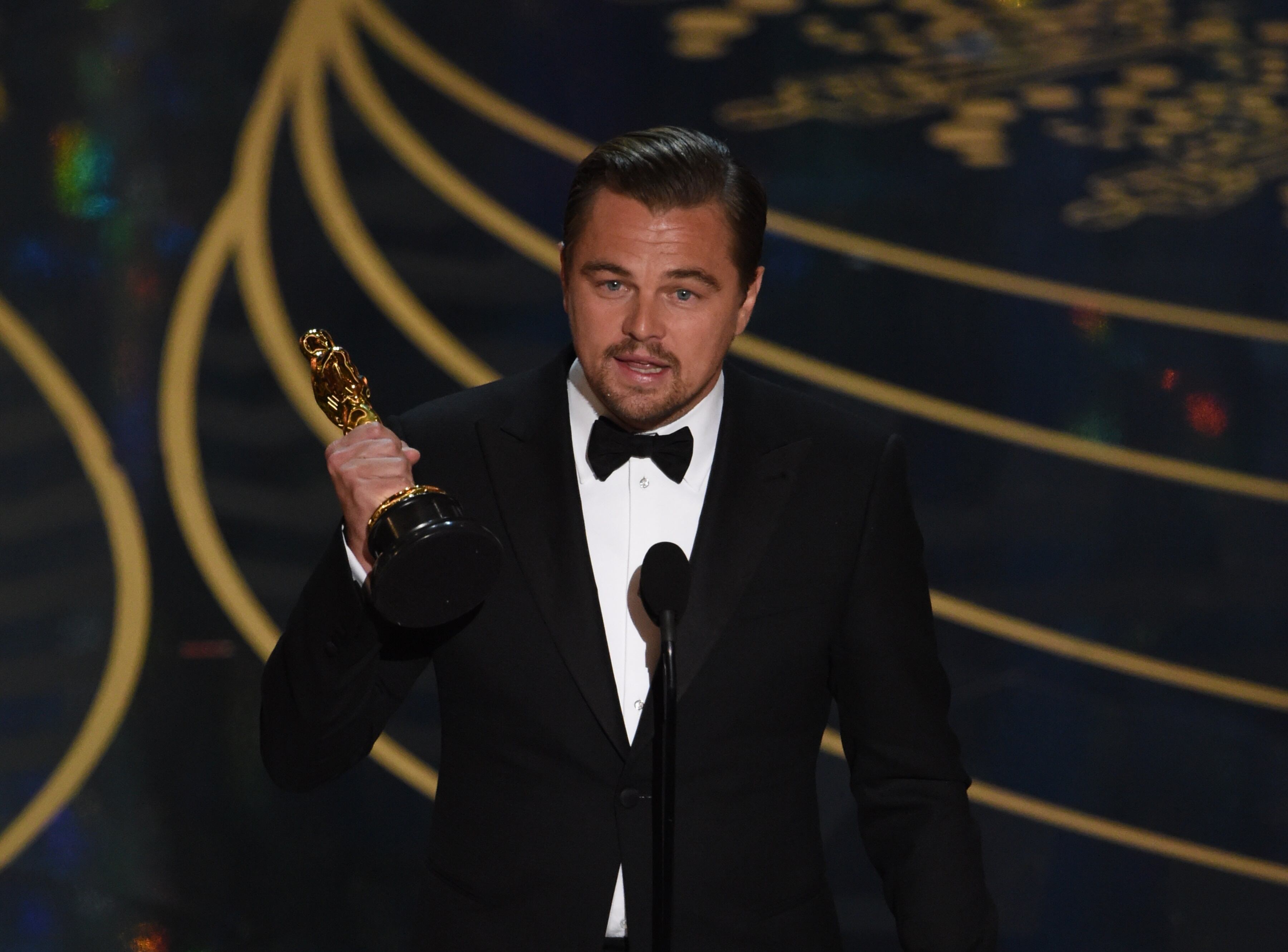 Actor Leonardo DiCaprio on stage at the 88th Oscars, 2016 MARK RALSTON/AFP via Getty Images)