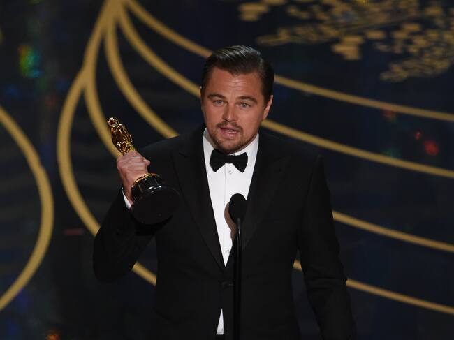 Actor Leonardo DiCaprio on stage at the 88th Oscars, 2016 MARK RALSTON/AFP via Getty Images)