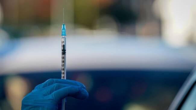 MANCHESTER, ENGLAND - DECEMBER 17: A nurse prepares to administer the Pfizer/BioNTech vaccine at a drive-thru COVID-19 vaccination centre in Hyde on December 17, 2020 in Manchester, England. The coronavirus drive-through vaccine centre is believed to be the first in the world. (Photo by Christopher Furlong/Getty Images)