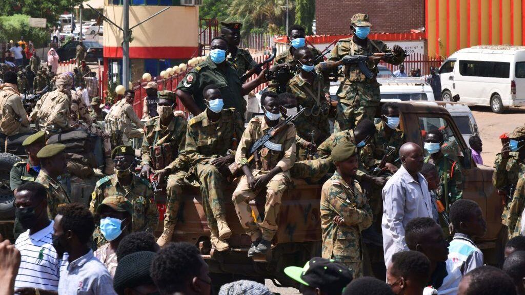 Sudanese security forces keep watch as they protect a military hospital and government offices during protests against a military coup overthrowing the transition to civilian rule on October 25, 2021 in the capital's twin city of Omdurman. - Sudan's top general declared a state of emergency and dissolved the authorities leading the country's democratic transition today, after soldiers detained civilian leaders in what the UN condemned as a "coup". (Photo by AFP) (Photo by -/AFP via Getty Images)