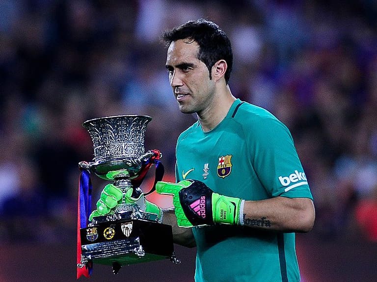 BARCELONA, SPAIN - AUGUST 17: The F.C.Barcelona goalkeeper, Claudio Bravo, posing with the cup, before the F.C.Barcelona vs Sevilla F.C., Spanish Super Cup match, at Nou Camp, on August 17, 2016 in Barcelona, Spain. (Photo by Joan Cros Garcia/Corbis via Getty Images)"n