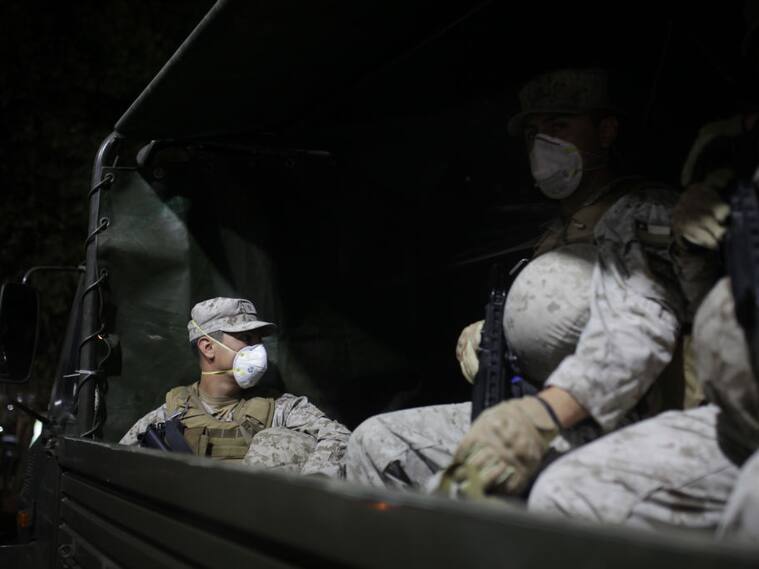 SANTIAGO, CHILE - MARCH 22: Military forces are seen over the streets of Santiago as curfew is declared by authorities after more than 600 cases and the first death of coronavirus (Covid-19) were announced in Chile on March 22, 2020. (Photo by Cristobal Saavedra Vogel/Anadolu Agency via Getty Images)