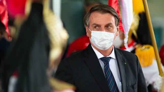BRASILIA, BRAZIL - DECEMBER 16: Brazilian President Jair Bolsonaro looks on after inauguration of newly appointed Minister of Federal Supreme Tribunal Andre Luiz de Almeida Mendonça on December 16, 2021 in Brasilia, Brazil. Former Justice Minister Mendonça had been nominated by President Jair Bolsonaro and then approved by Brazilian senate to fill a vacant position on the supreme court. (Photo by Andressa Anholete/Getty Images)